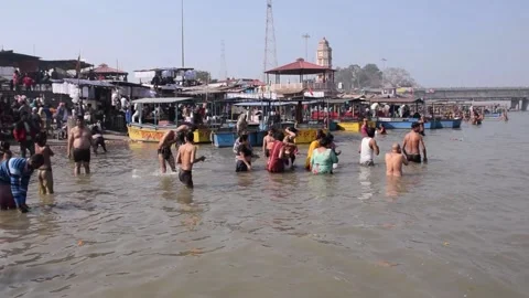 Hindu Devotees Bathing in Ganga River Stock Footage 131335027