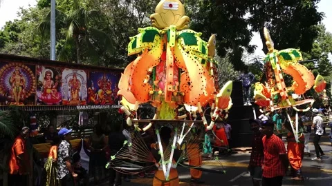 Hindu devotees carry kavadi dancing at road. Stock Footage 132771707