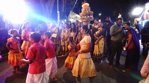Hindu devotees dance under colorful LED light at thaneer panthal. Stock Footage 129410543
