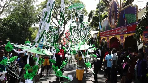 Hindu devotees hold kavadi dance at refreshment stall Stock Footage 132771957