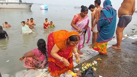 Hindu devotees performing Bathing the Ganges Stock-Footage 230237576