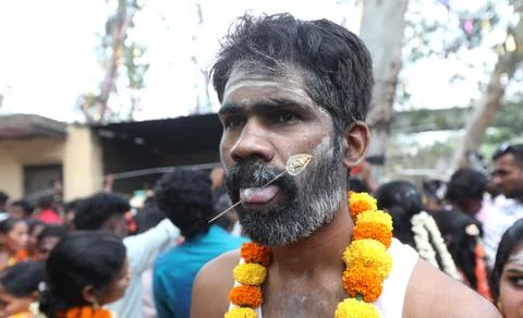 Hindu devotees with pierced bodies take part in a religious procession, New Delh Stock Photos