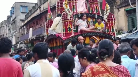 Hindu devotees pull decorated chariot during Rath Yatra in Howrah Stock Footage 340826066