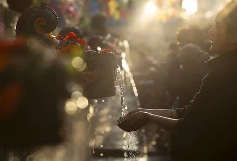 Hindu devotees take a holy bath at Balaju Purnima festival in Nepal, Kathmandu - Stock Photos