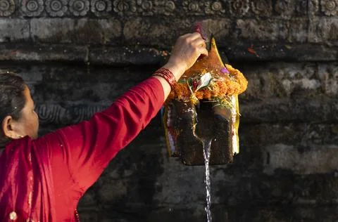 Hindu devotees take a holy bath at Balaju Purnima festival in Nepal, Kathmandu - Stock Photos