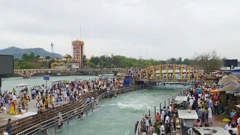 Hindu devotees taking a religious dip in the sacred waters of Ganga river at har Stock Photos
