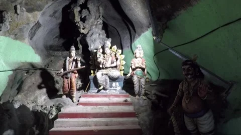 Hindu God statues on altar inside Main Temple cave, Batu caves, Kuala Lumpur Stock Footage 196381071