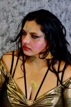 Hindu Goddess in gold dress and makeup. Stock Photos