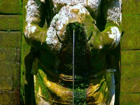 Hindu Goddesses statues making religious offerings. Goa Gajah, Bali. Indonesia Stock-Footage 74400429