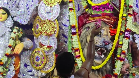 A hindu priest performing rituals of durga puja with a lotus in hand. He is.. Video stock 249506002