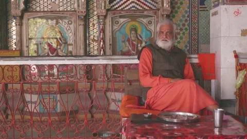 Hindu priest sitting in the temple Stock Footage 77454430
