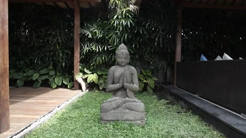 Hindu statue with hands together on heart in Bali, Indonesia Stock Footage 133473309
