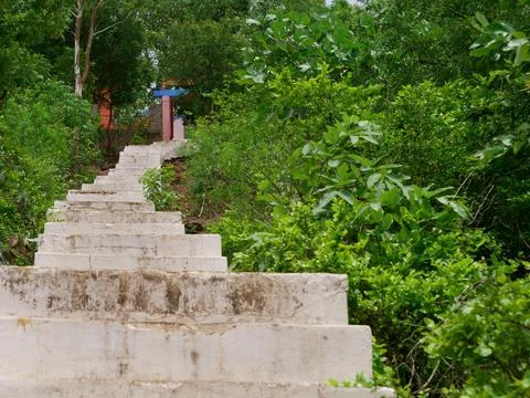 Hindu temple stairs down to up composition in natural mountain. 스톡 사진