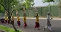 Hindu theater and music group walking on the street to their event location Bali 4k or 4k+ Resolution