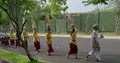 Hindu theater and music group walking on the street to their event location Bali 4k or 4k+ Resolution