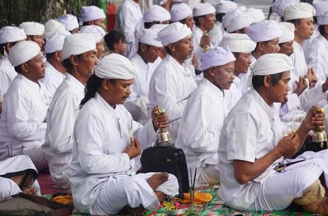 Hindus carry out prayers in the context of the Melasti ceremony Stock Photos