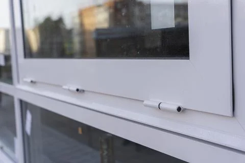 Hinges of new double-glazed windows opening, Replacement of double-glazed win Foto stock