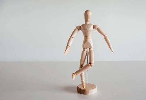 Hip external rotation on wooden model, piriformis syndrome Stock Photos