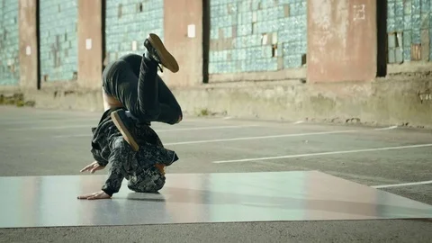 Hip-hop and breakdancing. Breakdancer dancing in the street. Slow motion. HD Stock Footage 81071401