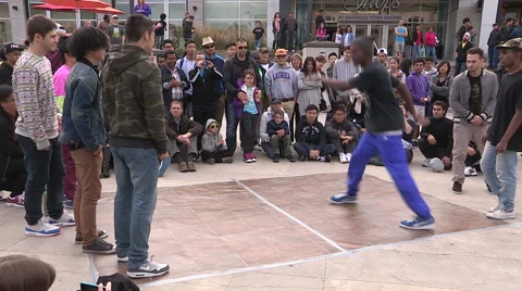 Hip hop break dance competition in urban centre streets Stock Footage