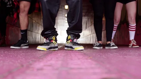 Hip hop crew dancing fast an hip hop sequence with his feet under a dark Stock Footage 99336276