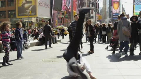 Hip hop dancer breakdancing windmills crowded Times Square slow motion 4K NYC Stock Footage 49963783