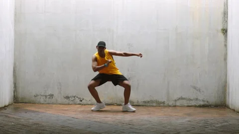 Hip hop dancer man dancing to music with energy in grunge aesthetic or youth Stock Footage 225641751