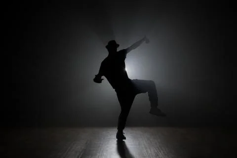 Hip-hop dancer posing backlit. Stock Photos