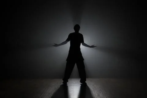Hip-hop dancer posing backlit. Stock Photos