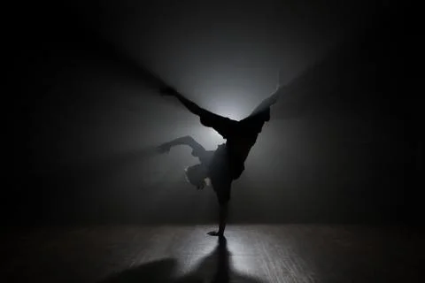 Hip-hop dancer posing backlit. Stock Photos