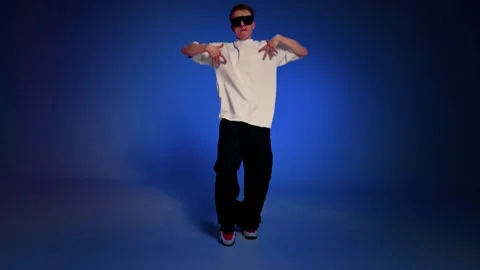 Hip hop dancer posing in studio with low angle view Stock Footage 345602330