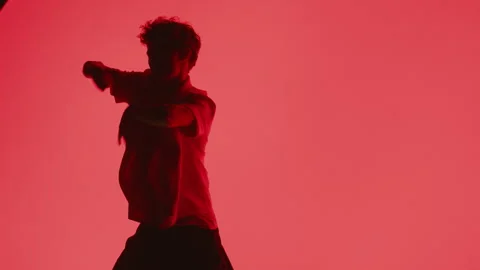 Hip-Hop Dancer On A Red Background Stock Footage 255537764