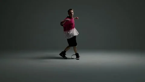Hip hop dancer standing with crossed arms in studio Stock Footage 345601434