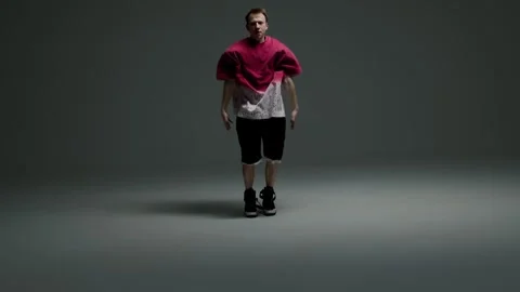 Hip hop dancer striking a powerful pose in studio Stock Footage 345601348