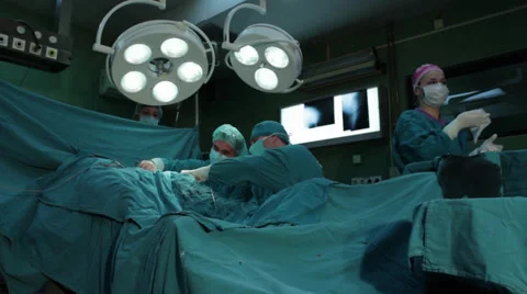 Hip surgery. Surgeons team performing operation in hospital operating room. Stock Footage 34605927