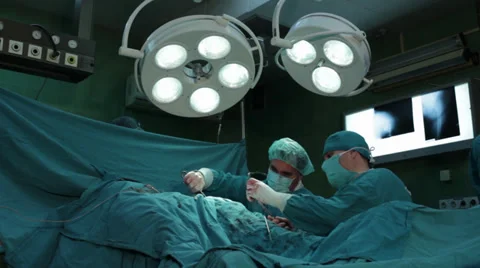 Hip surgery. Surgeons team performing operation in hospital operating room. Stock Footage 34609028