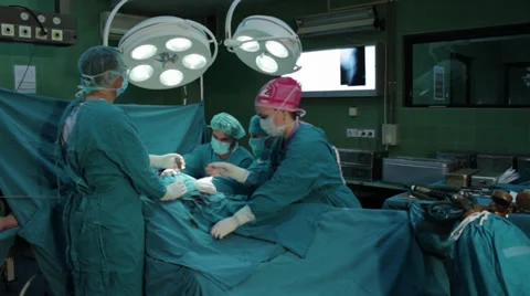 Hip surgery. Surgeons team performing operation in hospital operating room. Stock Footage 34610822