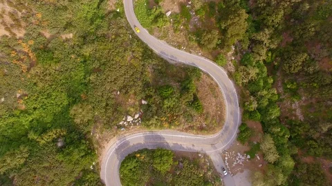 Hippie Mini Van Driving on the Road Through Hills Nature Aerial Drone View Stock Footage 128485335