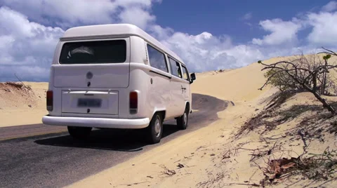 Hippie van driving through the desert Stock Footage 34469333