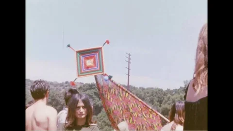Hippies dancing, playing music, and enjoying themselves at a concert in Tapia Stock Footage