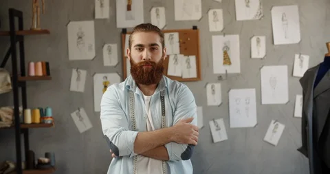 A hipster clothing designer working in his loft office, creating a new clothes Video stock 127863053