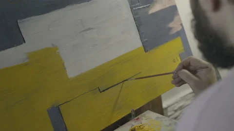 Hipster creates a picture in the workshop Stock-Footage 141750638