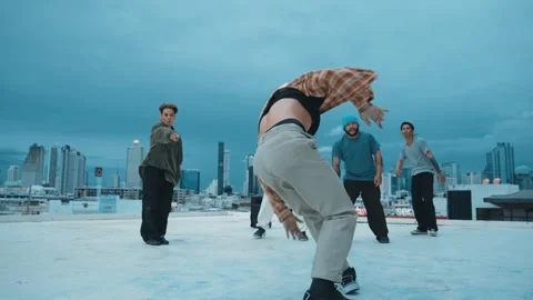 Hipster doing freeze pose while moving footstep to music at rooftop. hiphop. Stock Footage 257214503