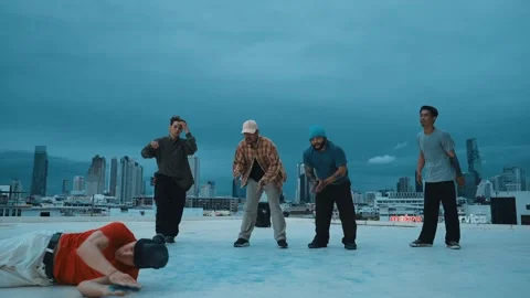 Hipster doing freeze pose while moving footstep to music at rooftop. hiphop. Stock Footage 261045523