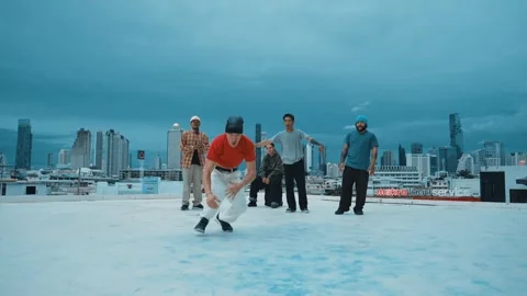 Hipster doing freeze pose while moving footstep to music at rooftop. hiphop. Stock Footage 261403667