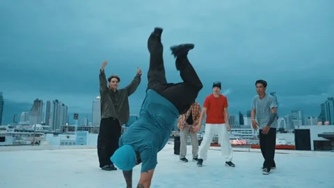 Hipster doing freeze pose while moving footstep to music at rooftop. hiphop. Stock Footage 262180361