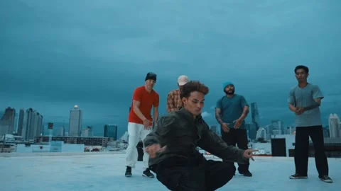 Hipster doing freeze pose while moving footstep to music at rooftop. hiphop. Stock Footage 263411521