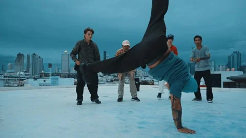 Hipster doing freeze pose while moving footstep to music at rooftop. hiphop. Stock Footage 264501874