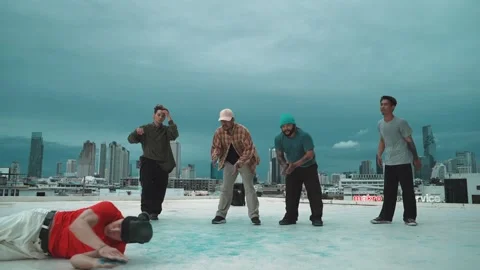 Hipster doing freeze pose while moving footstep to music at rooftop. hiphop. Stock Footage 270517331