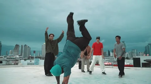 Hipster doing freeze pose while moving footstep to music at rooftop. hiphop. Stock Footage 272256105
